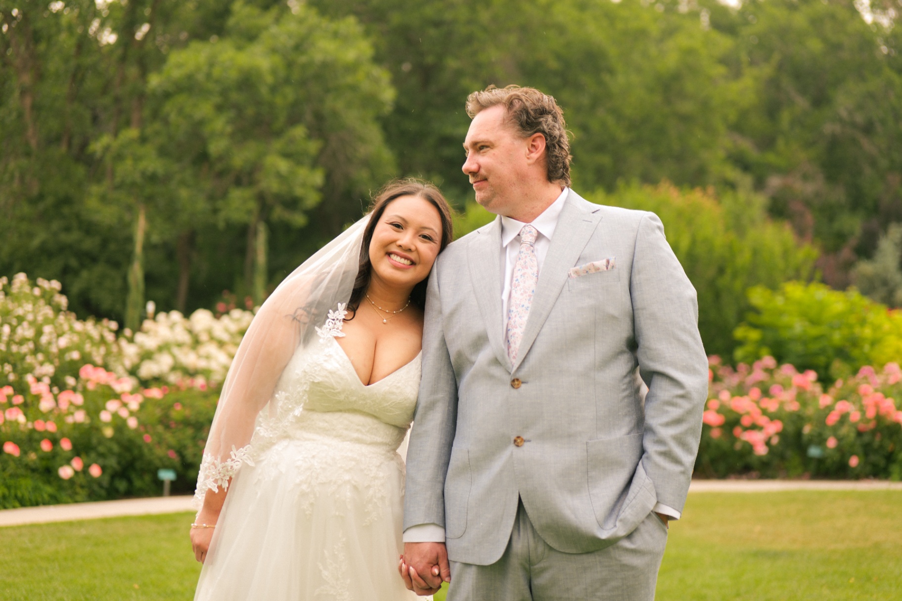Bride and groom in a rose garden