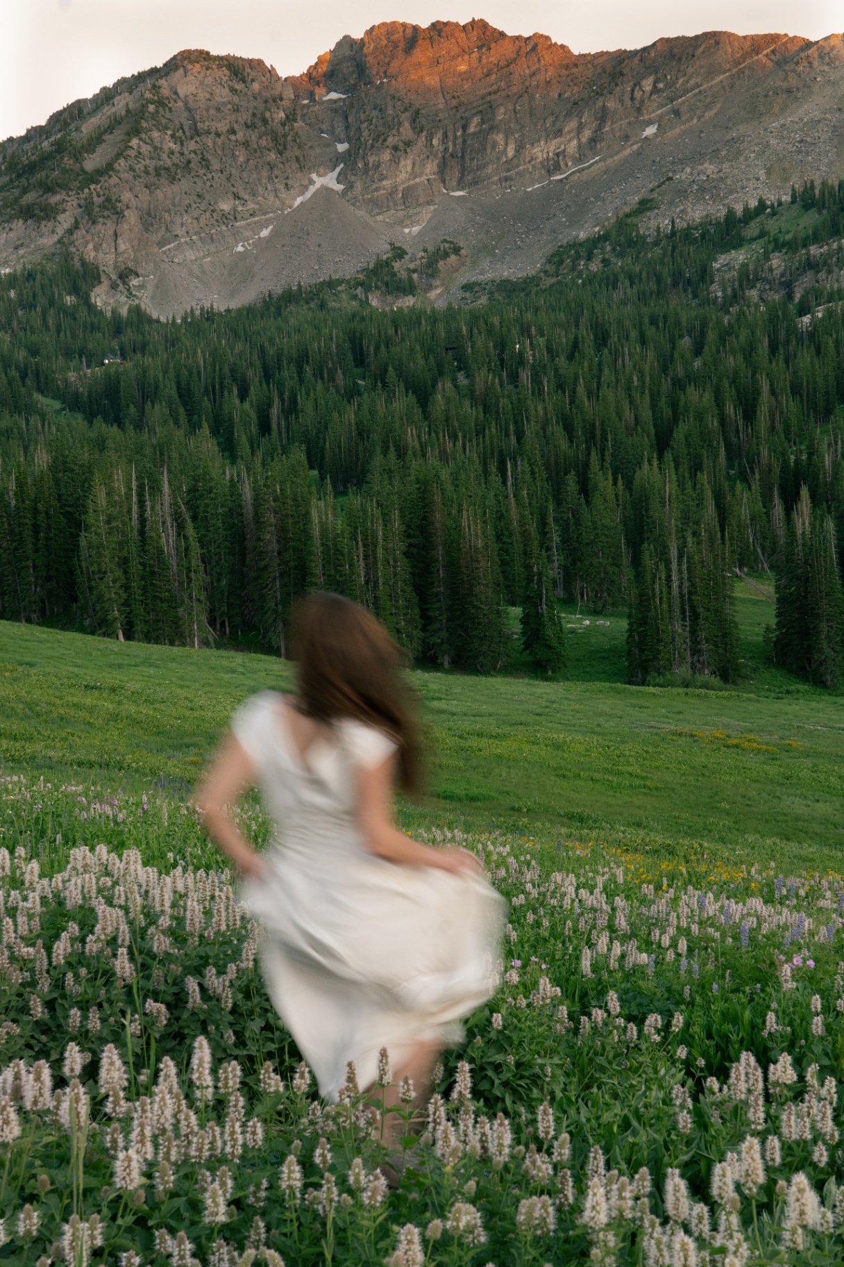 Motion blur portrait in a mountain meadow
